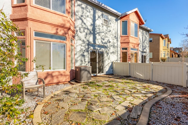 back of house featuring central AC and a patio area