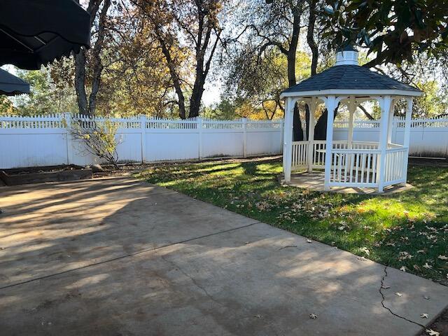 view of yard featuring a gazebo and a patio