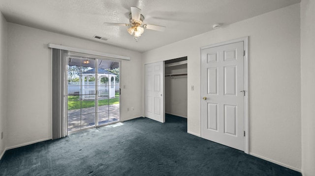 unfurnished bedroom with a ceiling fan, visible vents, a closet, access to outside, and dark carpet