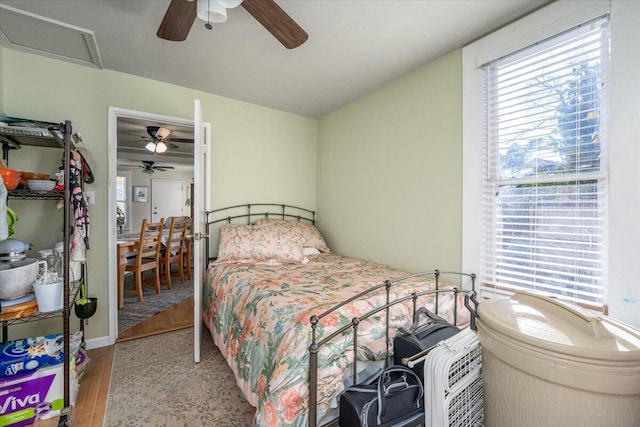 bedroom featuring ceiling fan and light hardwood / wood-style floors