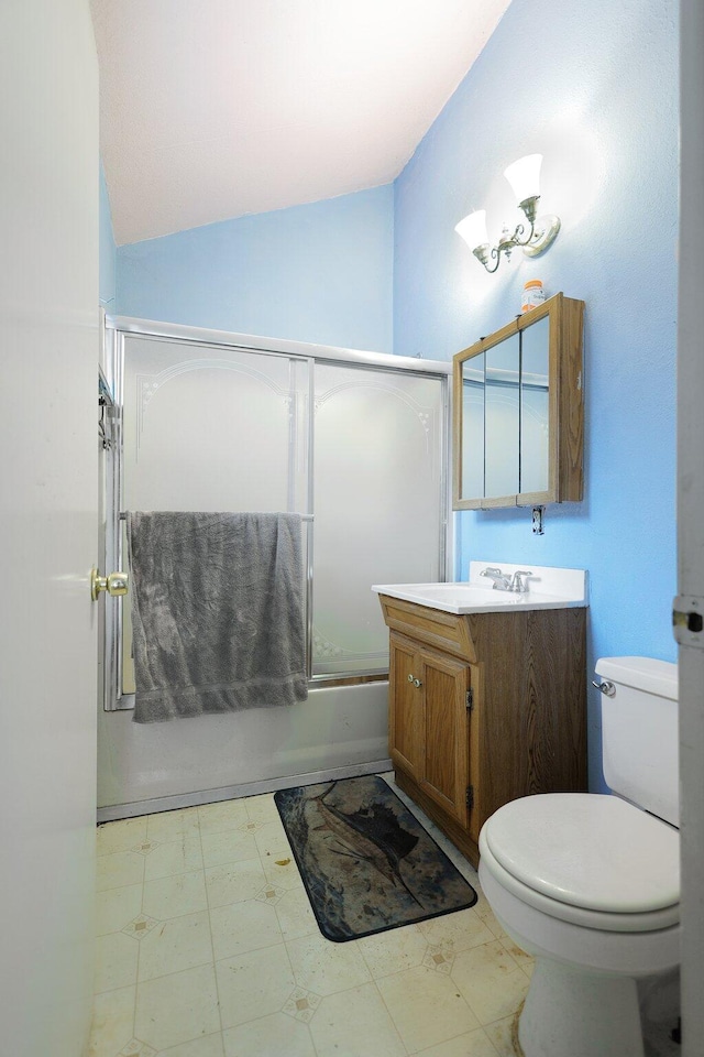 full bathroom with vanity, enclosed tub / shower combo, lofted ceiling, and toilet