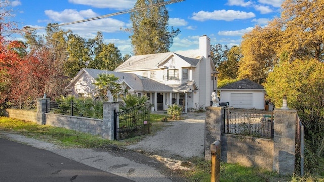 view of front of house with an outbuilding and a garage