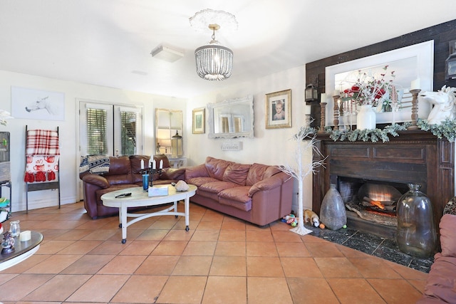 living room with light tile patterned floors and an inviting chandelier