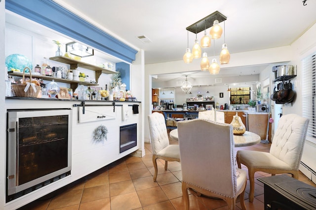 kitchen featuring tile patterned floors, wine cooler, and pendant lighting