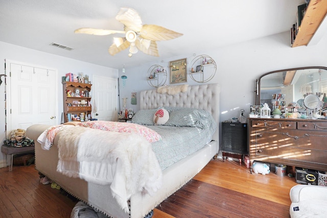 bedroom featuring dark hardwood / wood-style flooring and ceiling fan