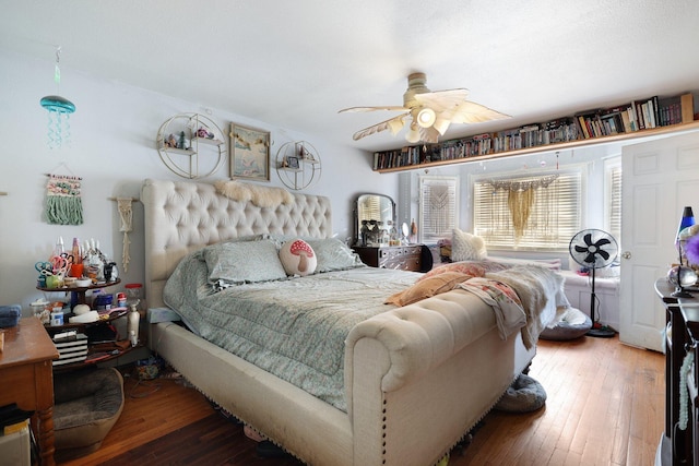 bedroom featuring hardwood / wood-style floors and ceiling fan