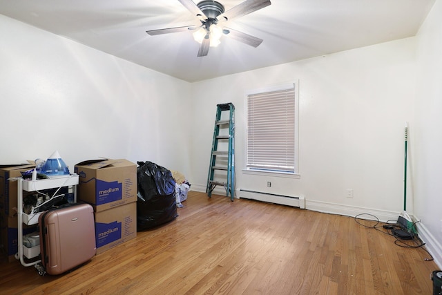 interior space featuring light hardwood / wood-style floors, baseboard heating, and ceiling fan