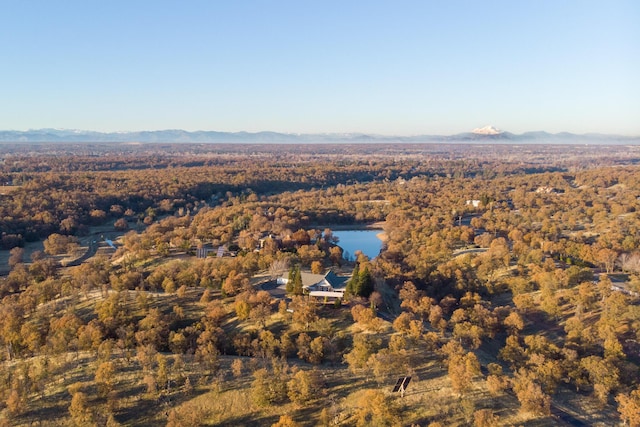 aerial view featuring a water and mountain view