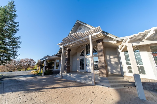 exterior space with a pergola