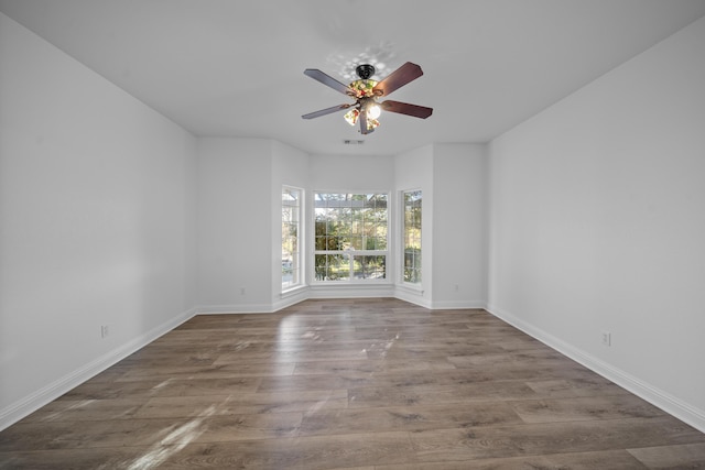 empty room featuring hardwood / wood-style floors and ceiling fan