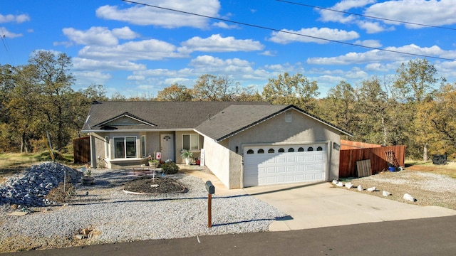 ranch-style house featuring a garage