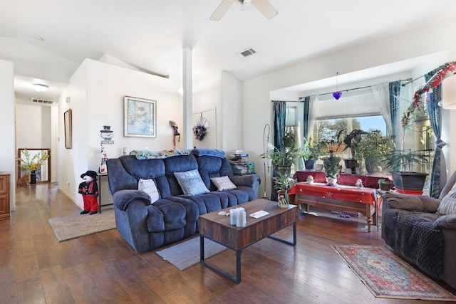 living room featuring lofted ceiling, ceiling fan, and dark hardwood / wood-style floors