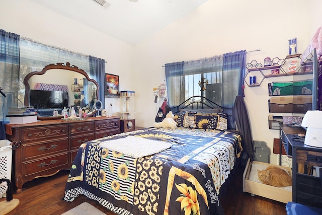 bedroom featuring dark hardwood / wood-style flooring and lofted ceiling