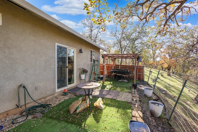 view of yard featuring a patio area and a pergola