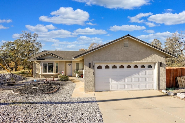 ranch-style home featuring a garage