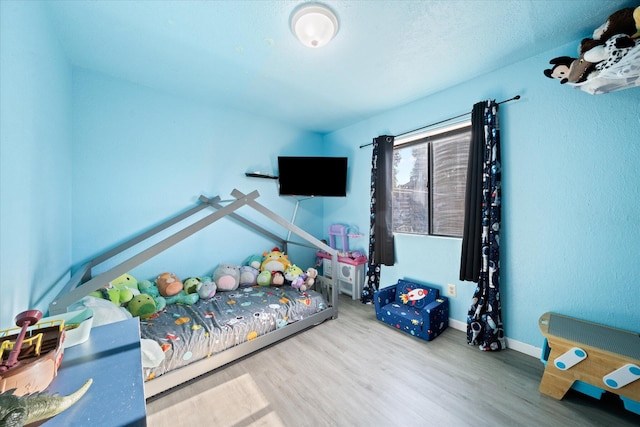 bedroom featuring wood-type flooring