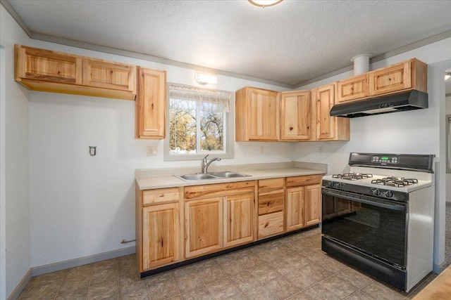 kitchen featuring white range with gas stovetop, light brown cabinets, a textured ceiling, and sink