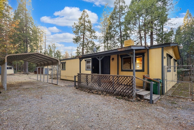 view of front of property featuring a carport