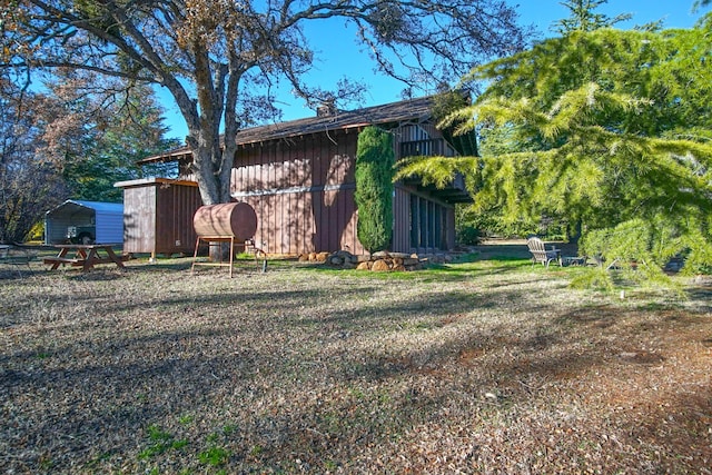 exterior space featuring an outbuilding and a carport