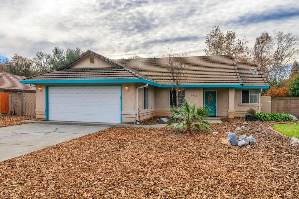 ranch-style house featuring a garage