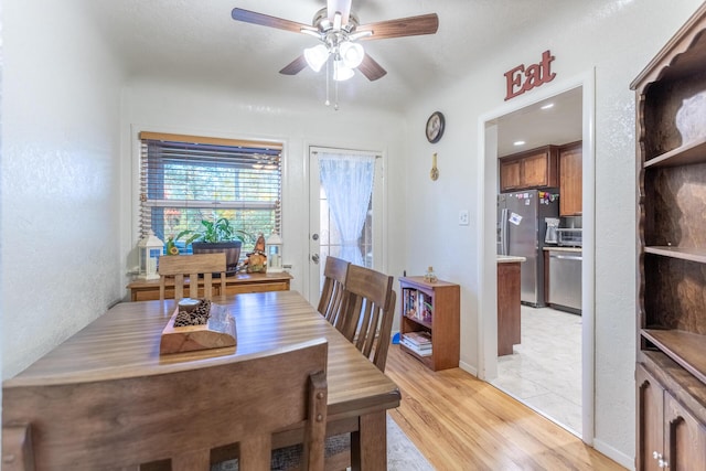 dining area featuring ceiling fan and light hardwood / wood-style flooring