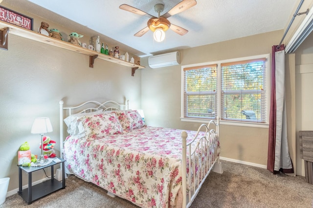 carpeted bedroom with a wall mounted air conditioner, a textured ceiling, and ceiling fan