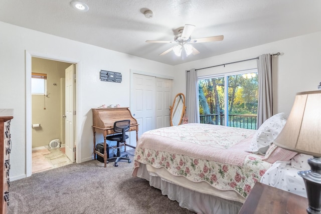 carpeted bedroom featuring access to outside, ceiling fan, a closet, and a textured ceiling