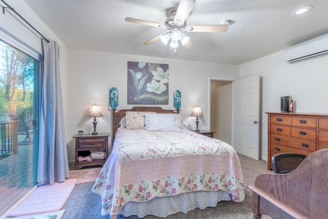 bedroom with access to exterior, ceiling fan, a wall unit AC, a textured ceiling, and light carpet