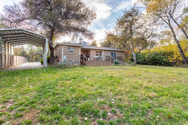 exterior space featuring a carport and a front yard