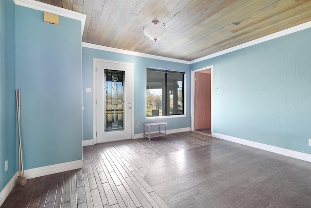 empty room featuring wood ceiling, crown molding, and hardwood / wood-style floors