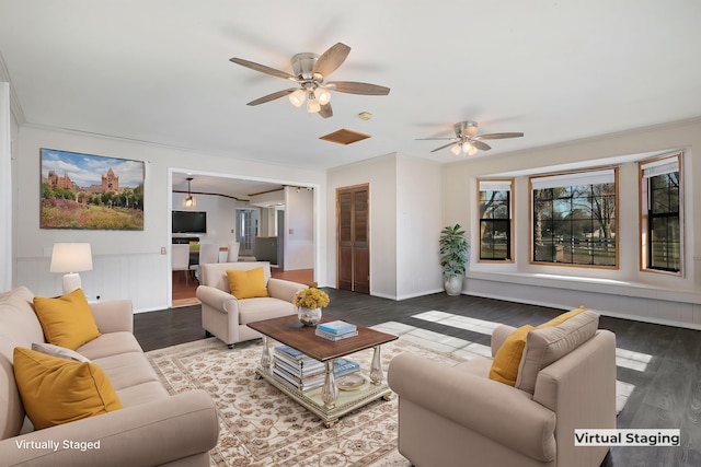 living room with crown molding, ceiling fan, and hardwood / wood-style flooring