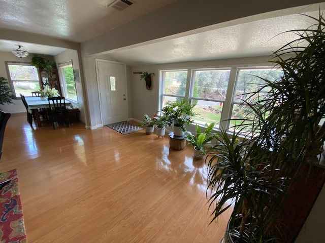 living room with wood-type flooring and vaulted ceiling