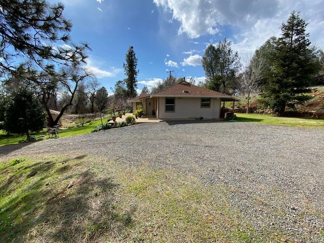 view of property exterior featuring a yard