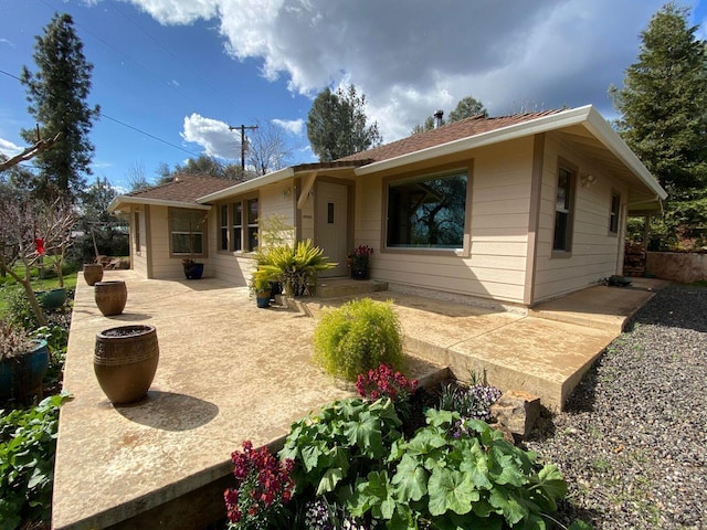 rear view of property with a patio