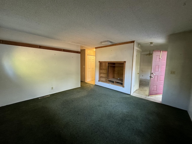 unfurnished living room featuring a textured ceiling and light colored carpet