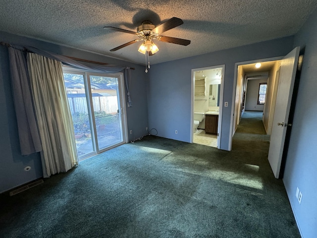 unfurnished bedroom with carpet, a textured ceiling, access to outside, and ceiling fan