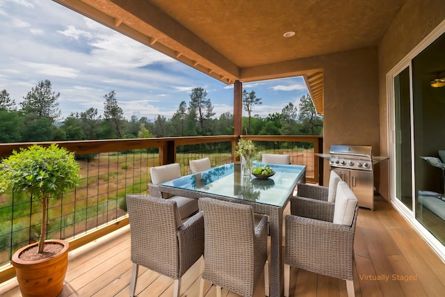 wooden deck with grilling area