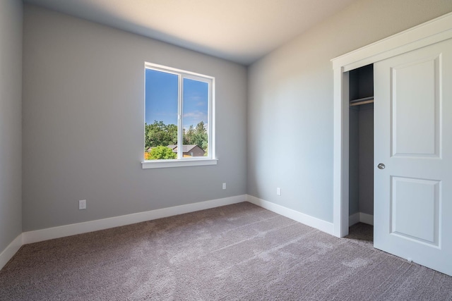 unfurnished bedroom featuring a closet and carpet floors