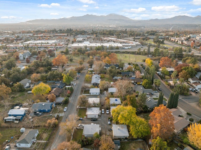 birds eye view of property with a mountain view