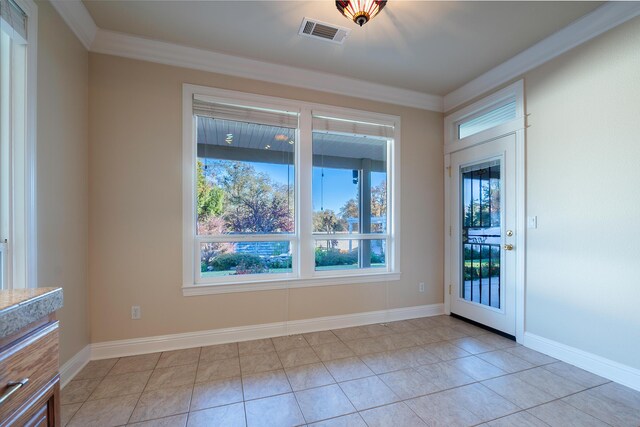 spare room featuring ornamental molding