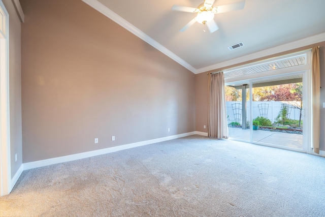 carpeted empty room featuring crown molding, lofted ceiling, and ceiling fan