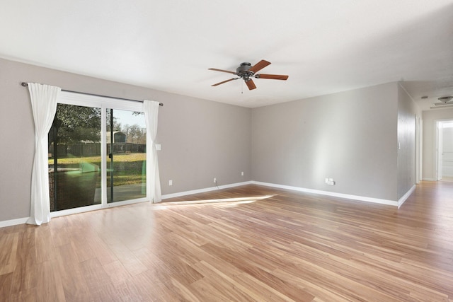 empty room featuring ceiling fan and light hardwood / wood-style floors