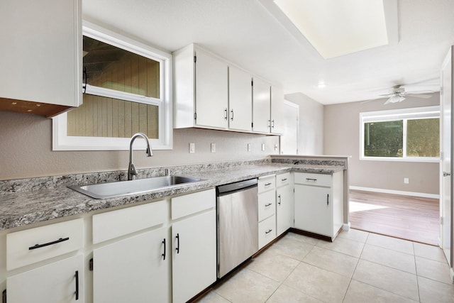 kitchen with white cabinets, stainless steel dishwasher, ceiling fan, and sink