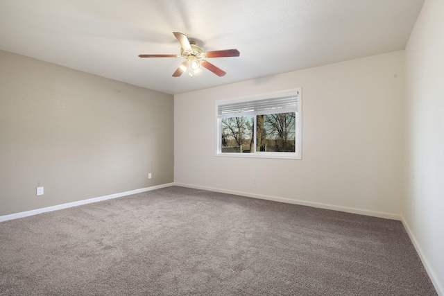 unfurnished room with carpet flooring and ceiling fan