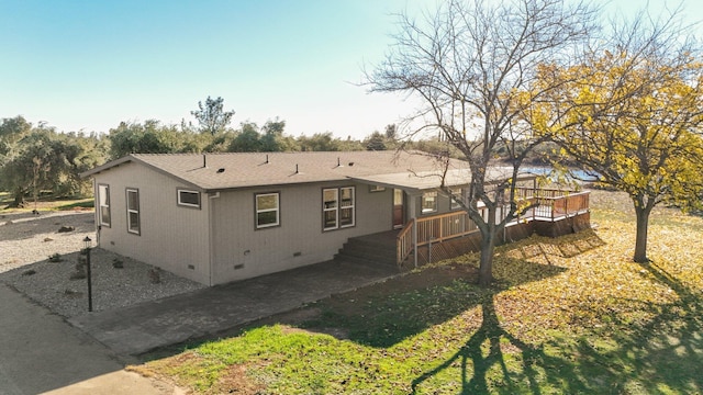 back of property featuring a deck