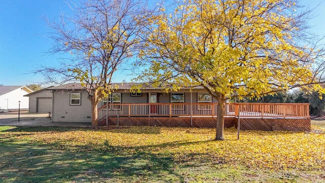 back of property featuring a yard and a deck