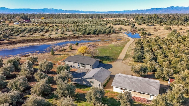 aerial view featuring a water and mountain view