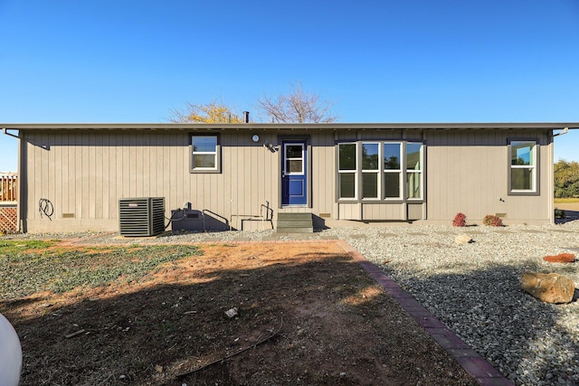 back of house featuring central AC unit