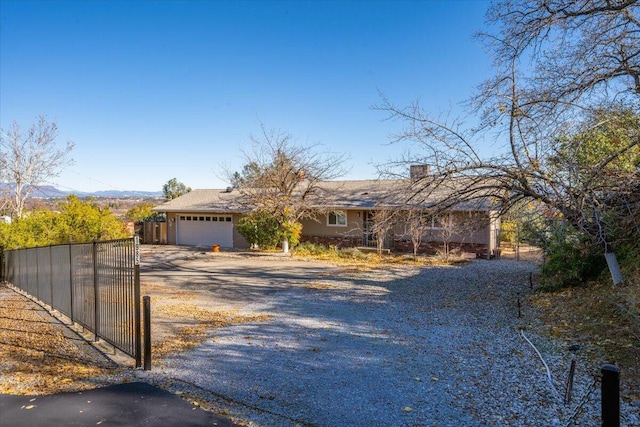 ranch-style home featuring a garage