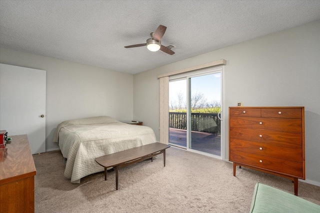 bedroom featuring carpet flooring, ceiling fan, a textured ceiling, and access to outside